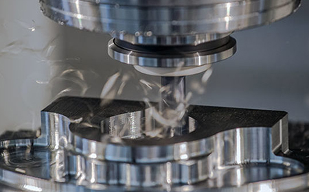 What parts does a vertical machining center consist of?